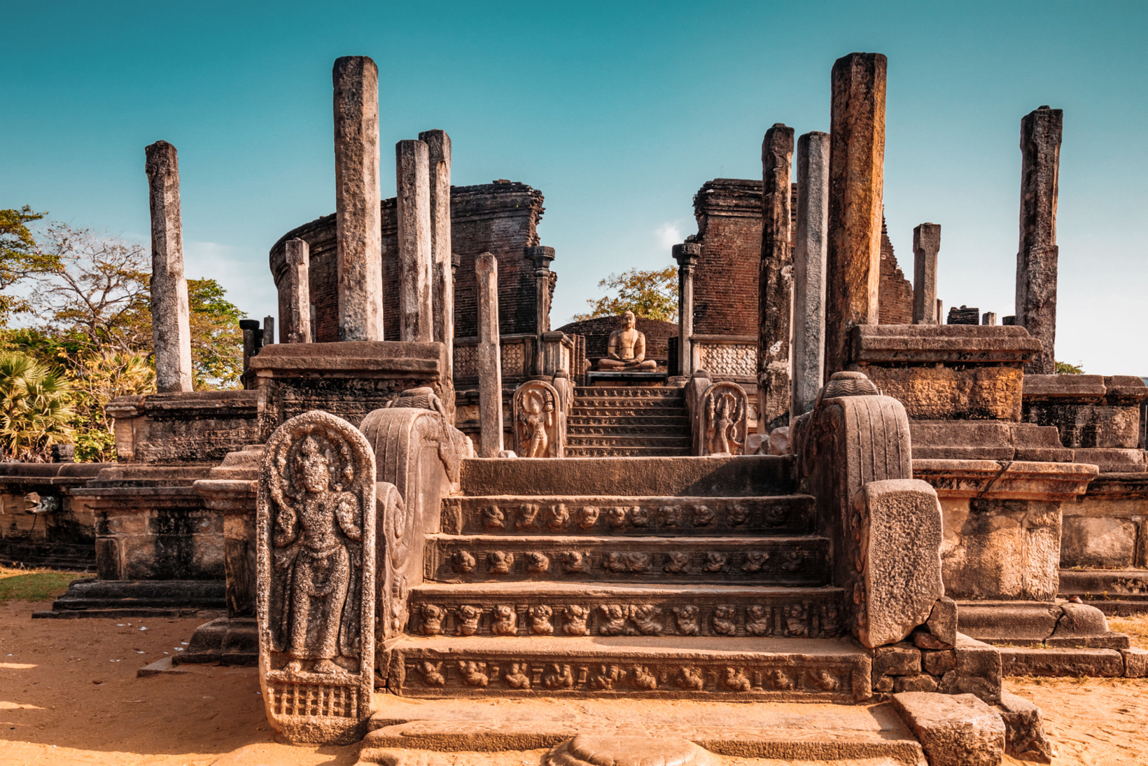 Ancient carved stone pillars and guardstone at the Vatadage