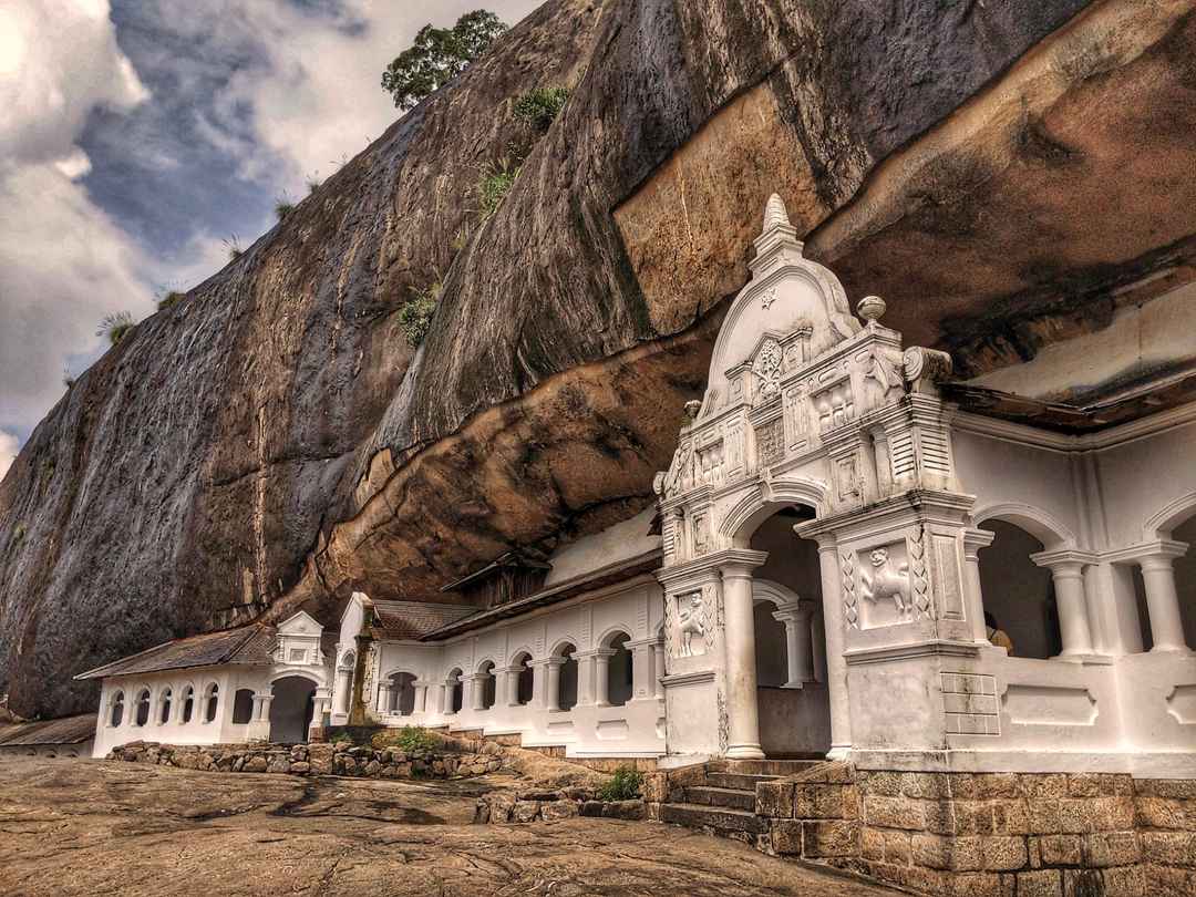 Historic rock-carved facade of Dambulla Cave Temple
