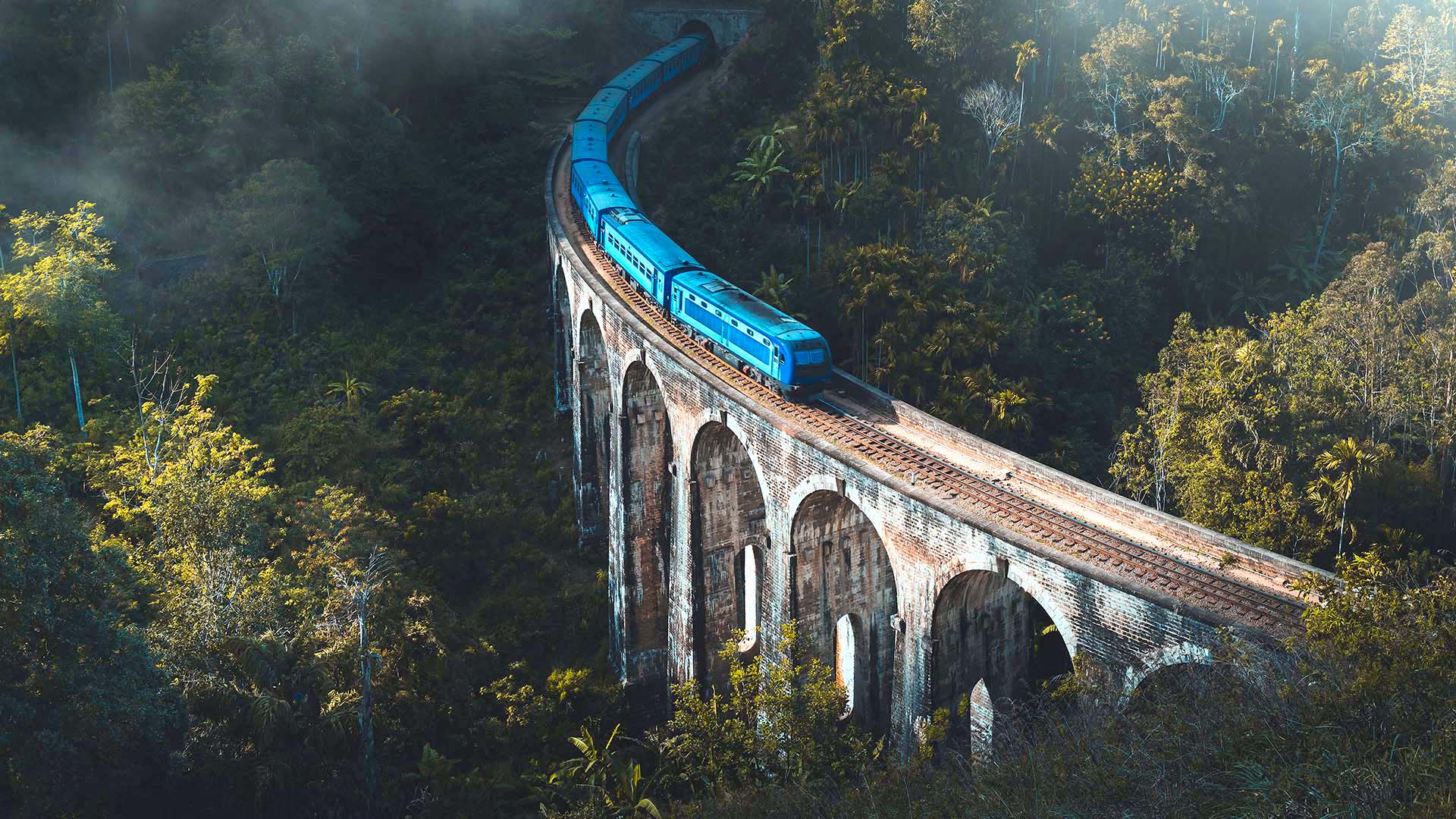 Scenic train crossing the Nine Arch Bridge in Ella, Sri Lanka